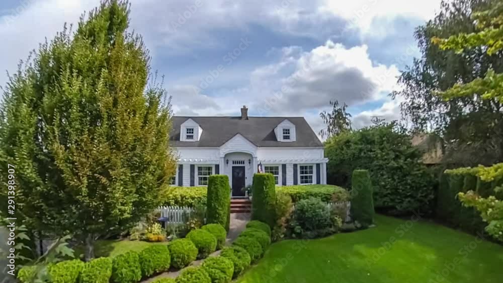 Quaint American suburban home exterior; departure drone point of view Quaint American suburban home exterior; departure drone point of view