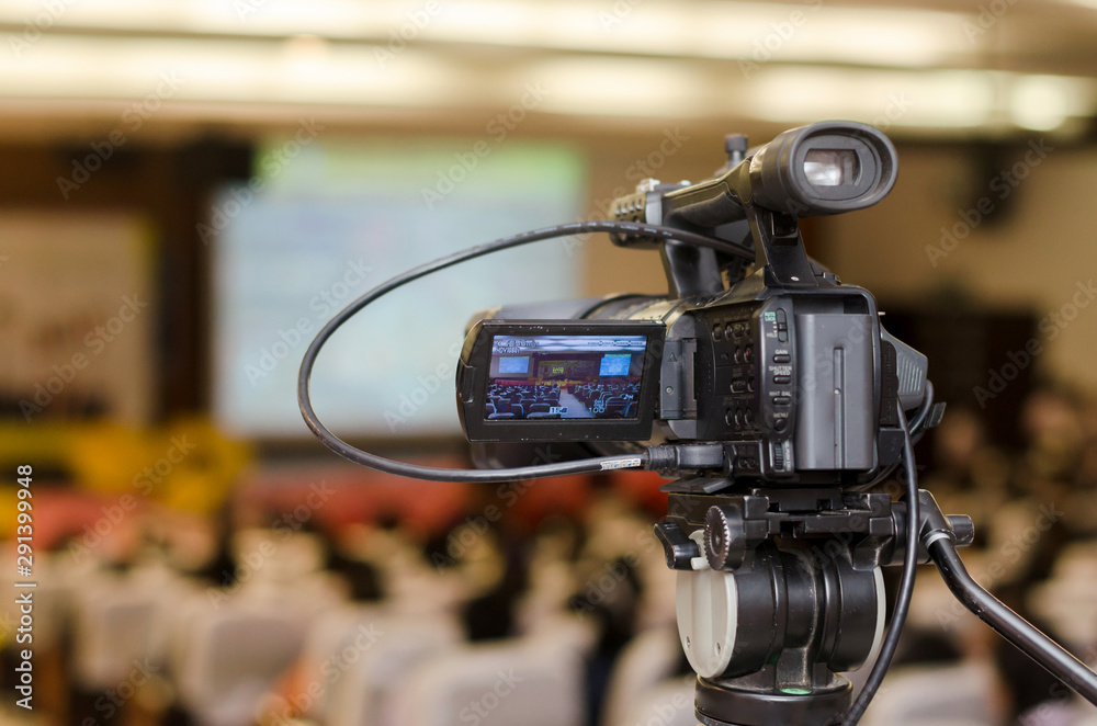 Video Camera recording seminar or learning in Conference room with blurred background, copy space
