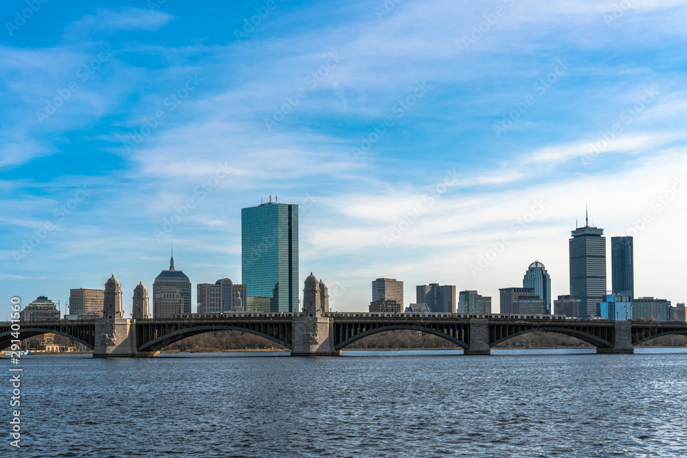 Scene of Train running over the Longfellow Bridge the charles river at the evening time, USA downtown skyline, Architecture and building with transportation concept