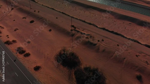 Aerial Desert and river view pan up from a lonely road