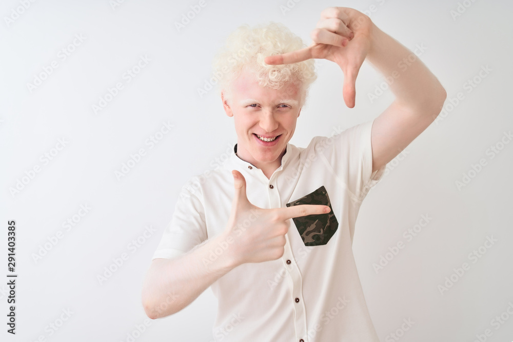 Young albino blond man wearing casual shirt standing over isolated white background smiling making frame with hands and fingers with happy face. Creativity and photography concept. Young albino blond man wearing casual shirt standing over isolated white background smiling making frame with hands and fingers with happy face. Creativity and photography concept.