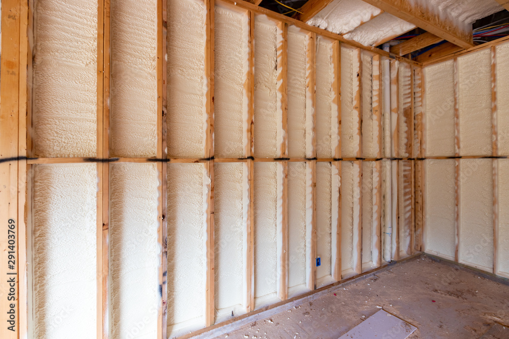 Wall in new home under construction, with spray foam insulation