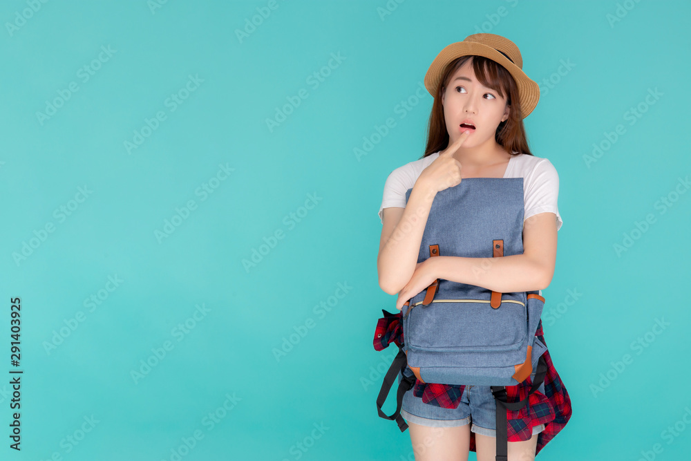 Ansøgning Modernisere Vanvid Beautiful portrait young asian woman wearing hat smiling and thinking idea  with holding backpack to travel summer trip in holiday in vacation isolated  blue background, tourist asia girl is having bag. Stock-foto 