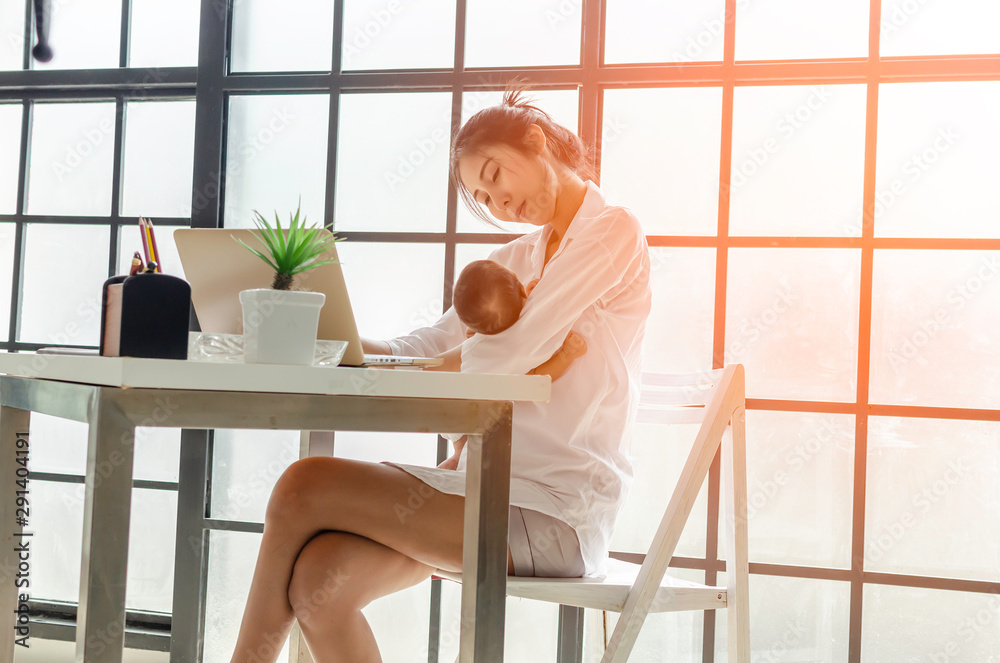 Mom working hard and be take care her baby with love Mom working hard and be take care her baby with love