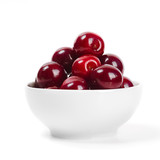 Cherries in cup isolated on white background.