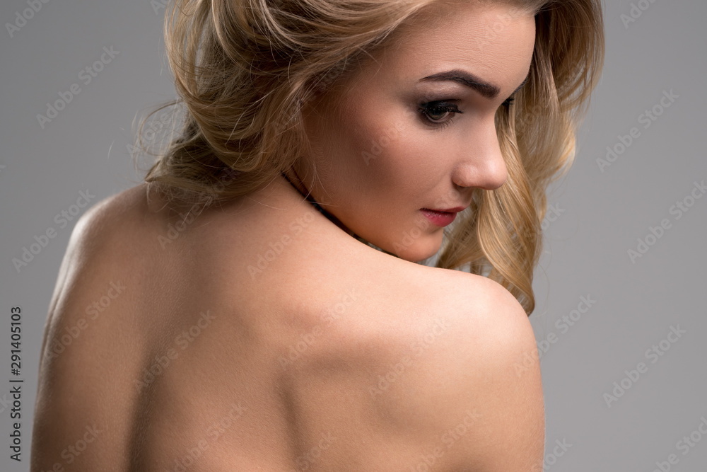 Image of lovely nude blonde posing back to camera Image of lovely nude blonde posing back to camera