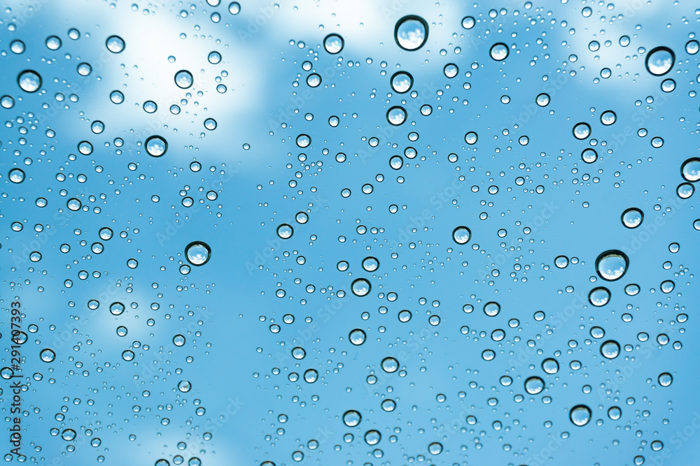 Rain on the window, natural skin of the rain The natural form of rainwater on a sky background. Rain on the window, natural skin of the rain The natural form of rainwater on a sky background.
