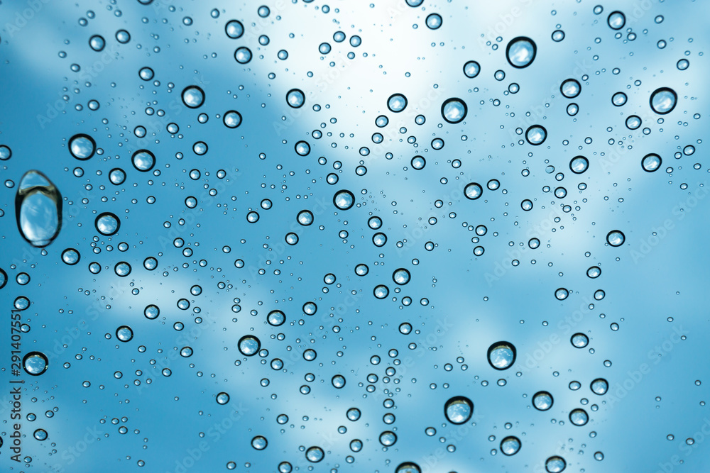 Rain on the window, natural skin of the rain The natural form of rainwater on a sky background. Rain on the window, natural skin of the rain The natural form of rainwater on a sky background.
