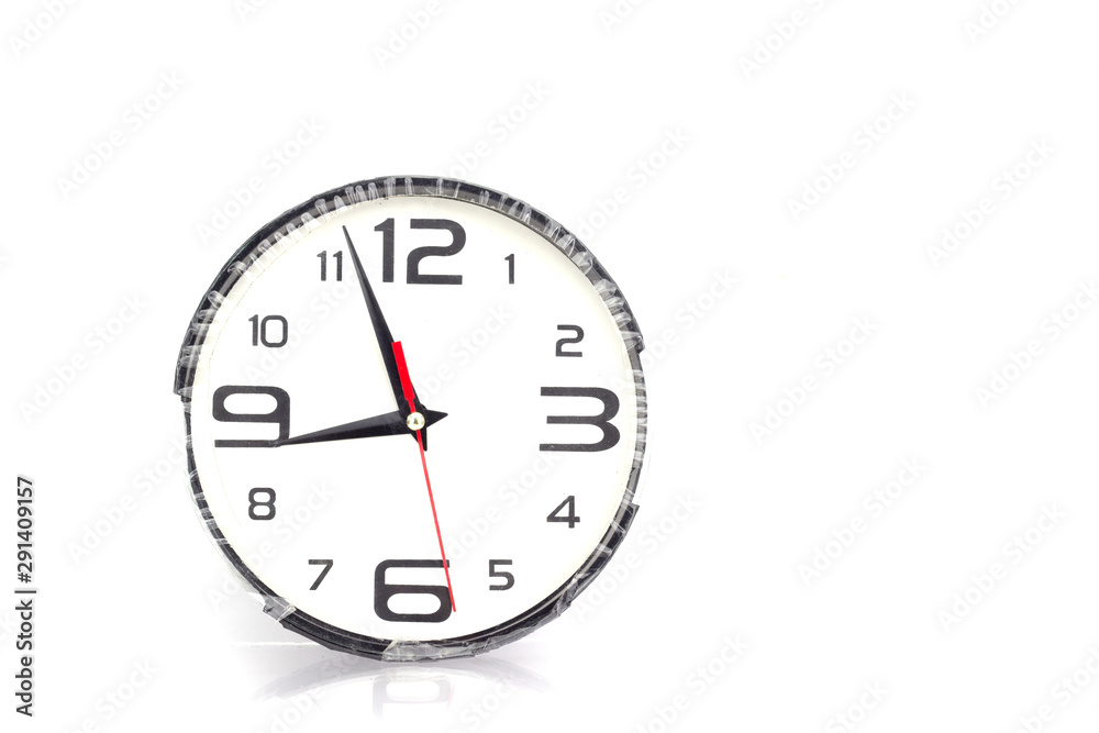 Wall clock hanging on a white background. Wall clock hanging on a white background.