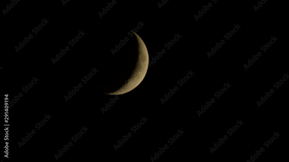 The moon movement in the dark night sky, hiding behind the building at the end. The moon movement in the dark night sky, hiding behind the building at the end.
