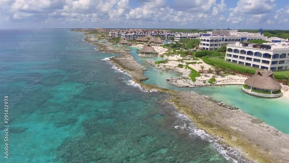 Sweeping aerial drone shot of a massive beach resort in the Mayan Riviera (Mexico). Sweeping aerial drone shot of a massive beach resort in the Mayan Riviera (Mexico).
