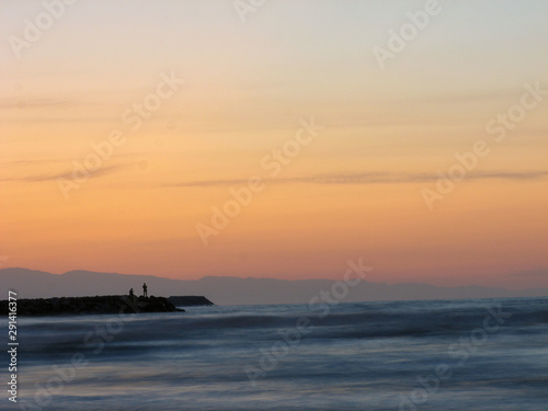 Sunset sky abstract background. Yellow sunset sky over the sea. Golden time of sky at sunset - sunrise time in summer season. Warm color sky yellow. White space for text.