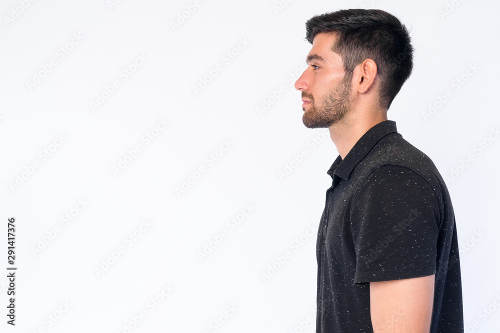 Closeup profile view of young bearded Persian man Closeup profile view of young bearded Persian man