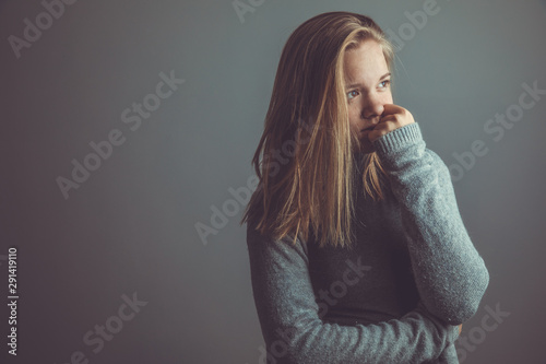 Young woman suffering from a severe stomach pain/depression/anxiety photo
