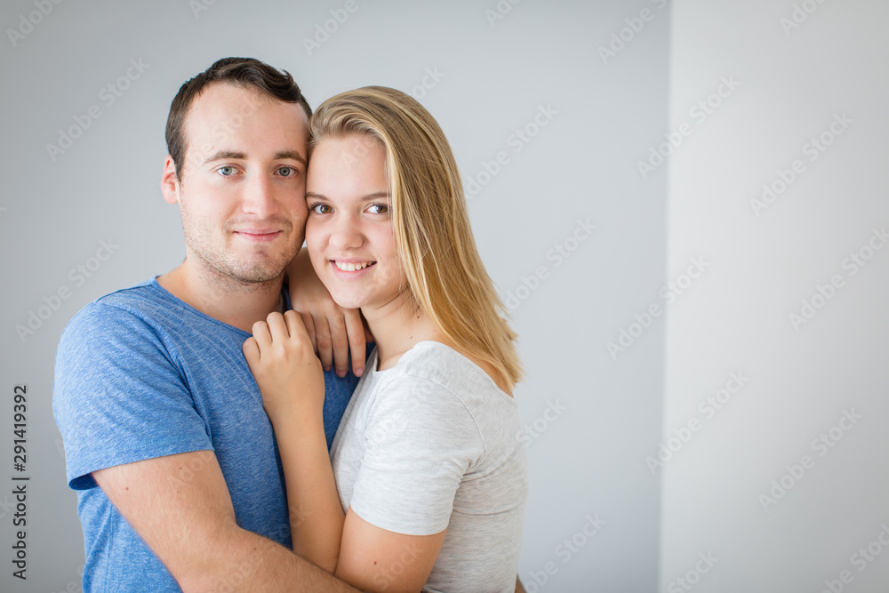 Brother and sister posing for a photo together. Hugging and smiling, feeling caring and loved. Brother and sister posing for a photo together. Hugging and smiling, feeling caring and loved.