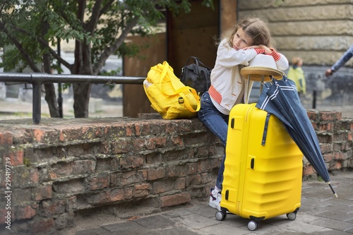 Concept of tourism, travel, little girl with luggage