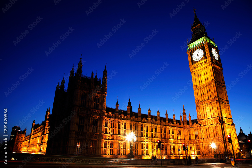 Night view of Westminster Palace over dramatic blue sky