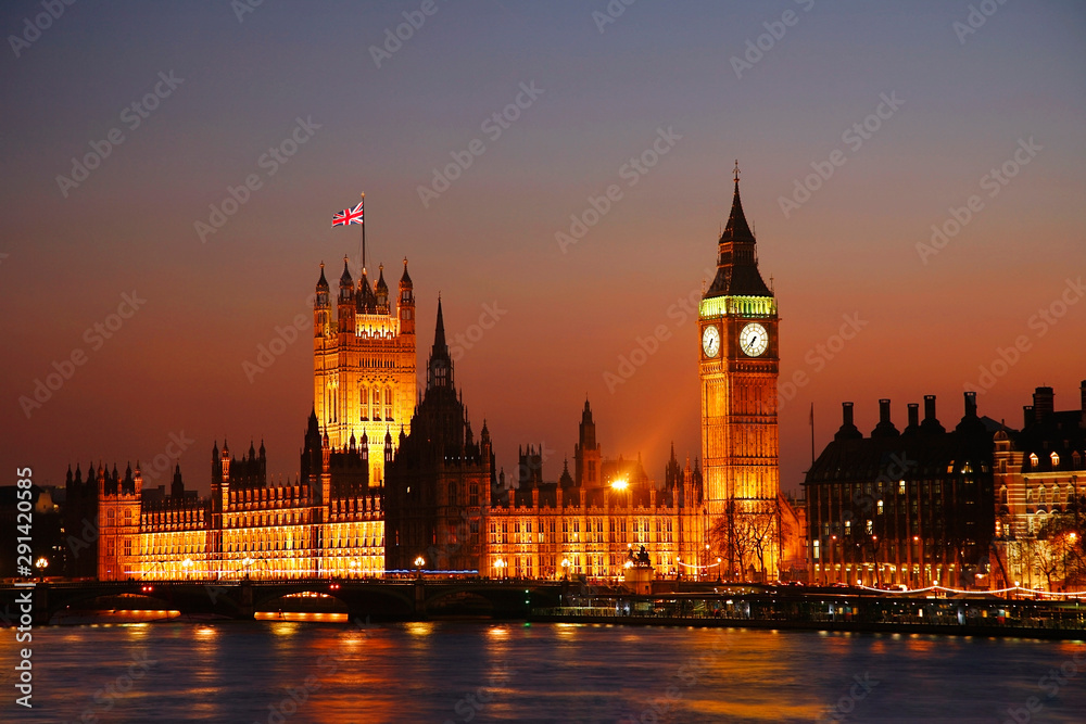 Night view of Westminster Palace over dramatic sunset sky