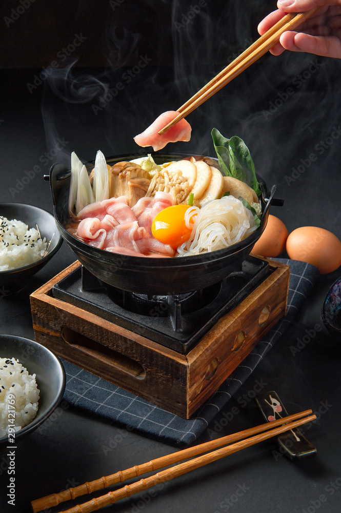 Japanese hotpot buta akakara nabe with pork rice set . In lighting
