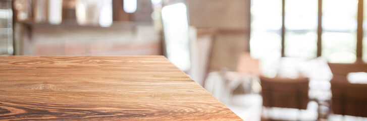 wood table top product display background with blur people in green cafe restaurant.left perspective wooden kitchen counter.Banner mockup presentation for your product online