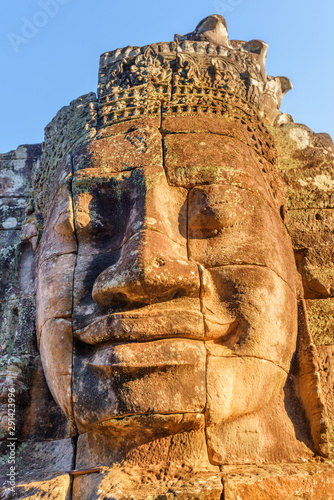 Unusual view of giant stone face of Bayon temple  Angkor