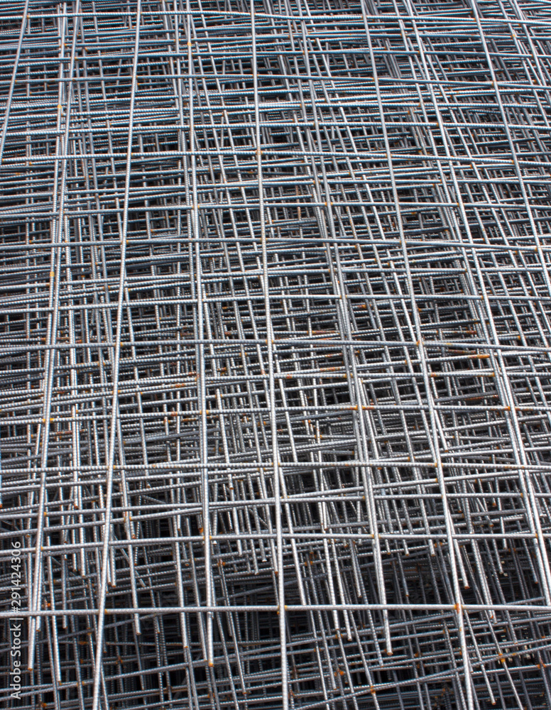 Stack of steel construction mesh with rust. Steel mesh texture. Vertical photo