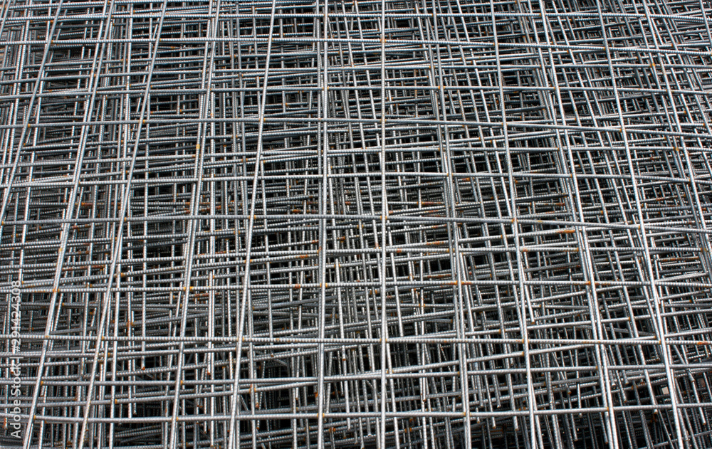Stack of steel construction mesh with rust. Steel mesh background. Horizontal photo
