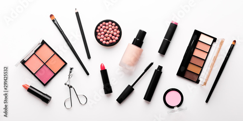 Assortment of luxury cosmetics for every day makeup on white