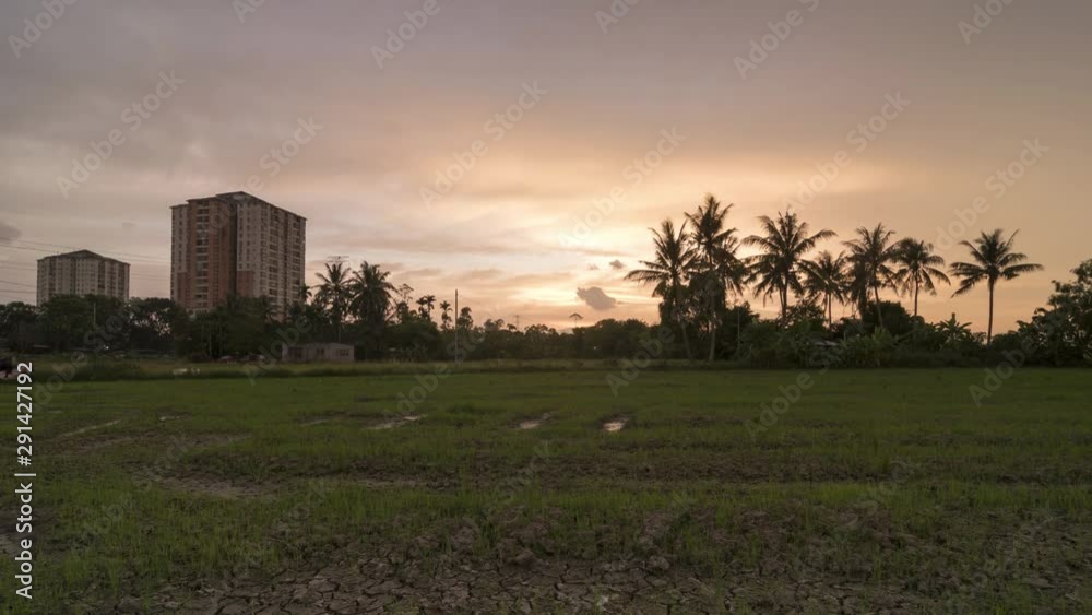 Timelapse sunset hour with red cloud at paddy field with dry and muddy land. Timelapse sunset hour with red cloud at paddy field with dry and muddy land.