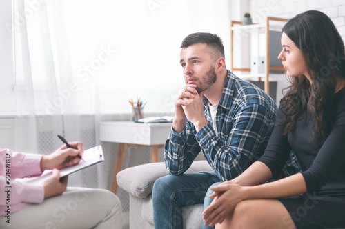 Young grumpy couple at marital counseling therapy