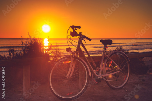 Bicycle on beach, active lifestyle.