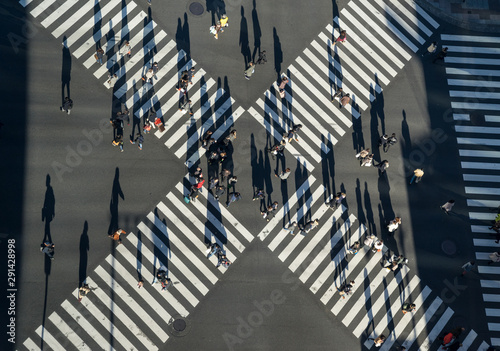 Photography Aerial view of people passing crosswalk in the downtown street.