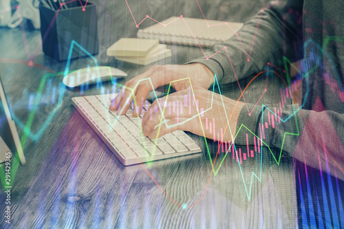 Multi exposure of financial graph with man works in office on background. Concept of analysis.