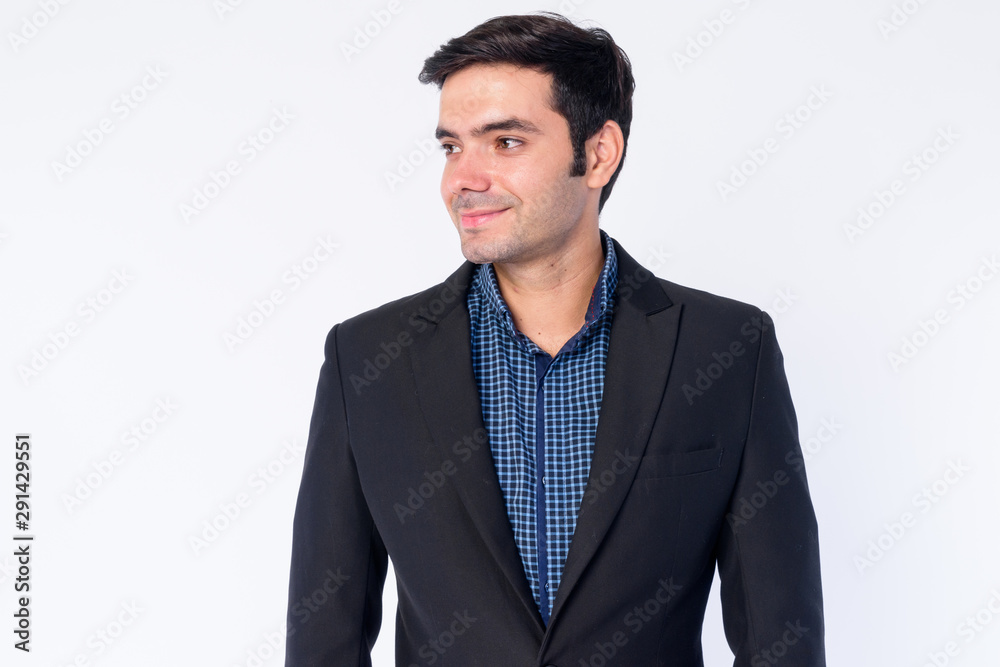 Face of happy young handsome Persian businessman in suit thinking Face of happy young handsome Persian businessman in suit thinking