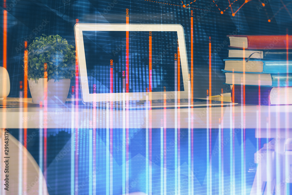 Financial graph colorful drawing and table with computer on background. Multi exposure. Concept of international markets.