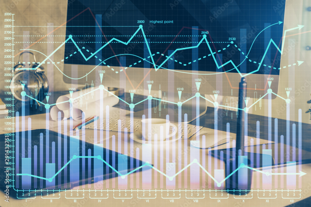 Financial graph colorful drawing and table with computer on background. Double exposure. Concept of international markets.