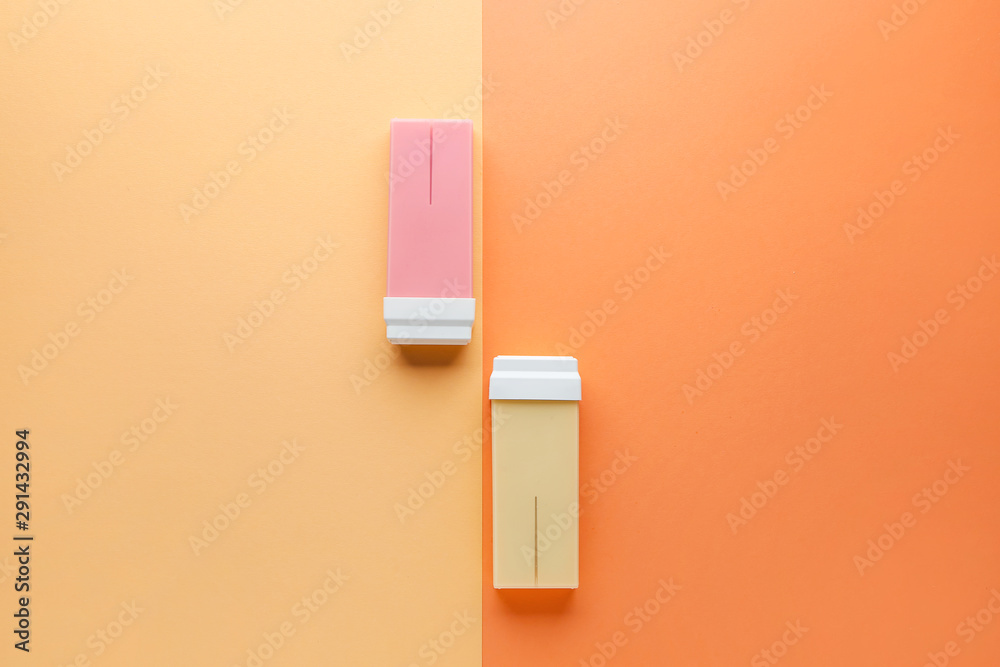 Liposoluble wax cartridges on color background Liposoluble wax cartridges on color background