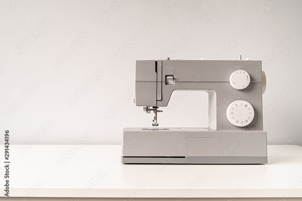sewing machine on tailor table with copy space