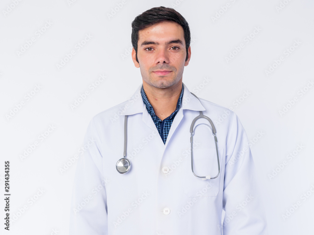 Face of young Persian man doctor looking at camera