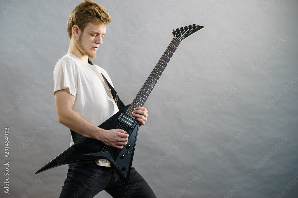 Fototapeta premium Man playing on electric guitar