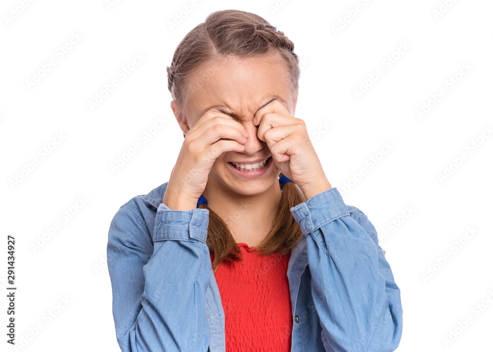 Portrait of teen girl with sad expression covering face with hands while crying. Unhappy child crying, not showing her tears. Upset caucasian young teenager, isolated on white background. Portrait of teen girl with sad expression covering face with hands while crying. Unhappy child crying, not showing her tears. Upset caucasian young teenager, isolated on white background.