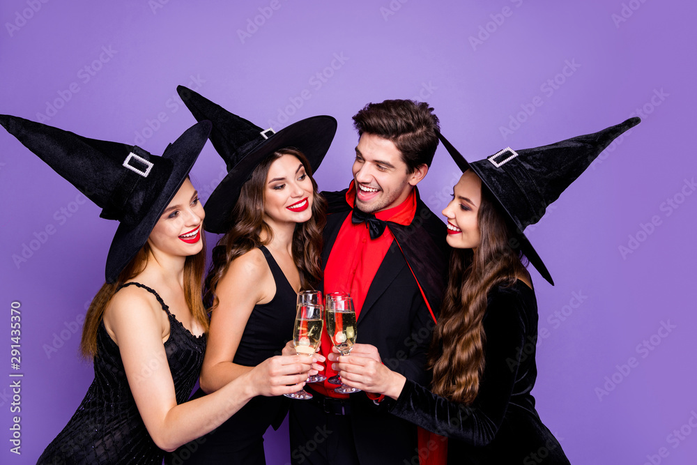 Photo of three excited witch ladies and warlock guy chilling at halloween  party drink golden wine wear black dresses hats and vampire coat isolated  purple color background Stock Photo | Adobe Stock