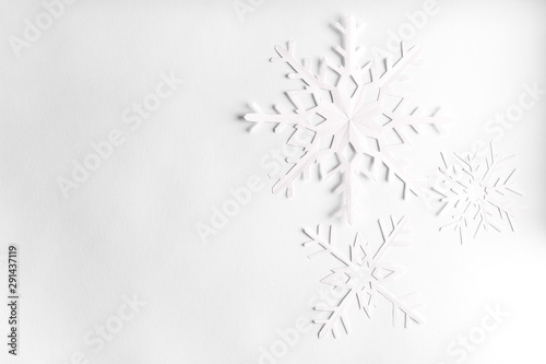 white background with paper snowflakes