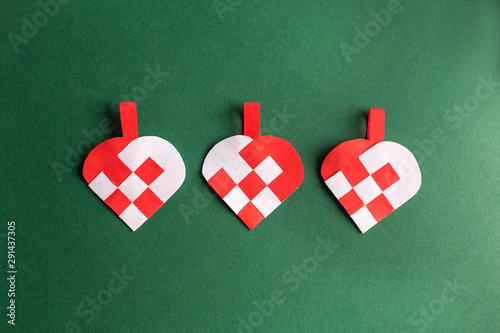 Traditional and typical Christmas Danish decoration made of paper woven heart