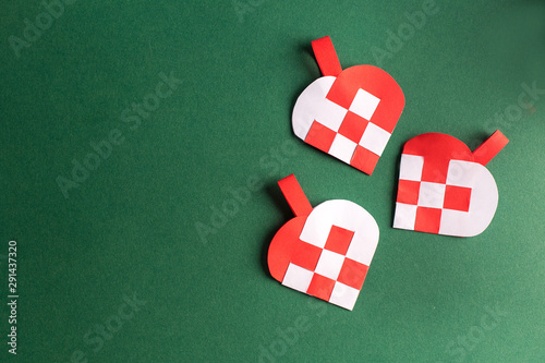 Traditional and typical Christmas Danish decoration made of paper woven heart