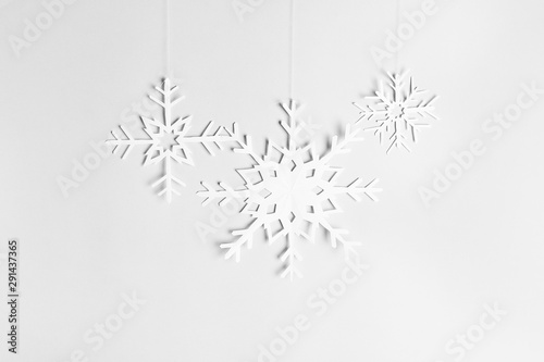 background with hanging paper snowflakes