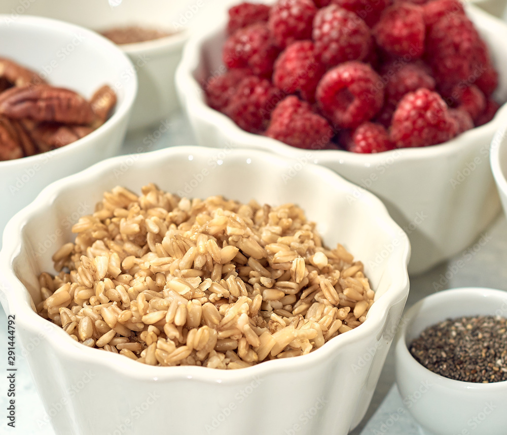Oatmeal porridge with raspberry and figs in a bowl Oatmeal porridge with raspberry and figs in a bowl