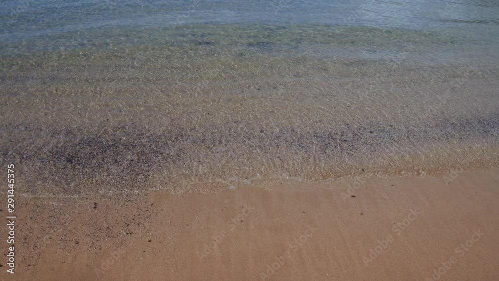 Hawaii Water Sand tiny waves with lava pebbles Big Island Hawaii Water Sand tiny waves with lava pebbles Big Island