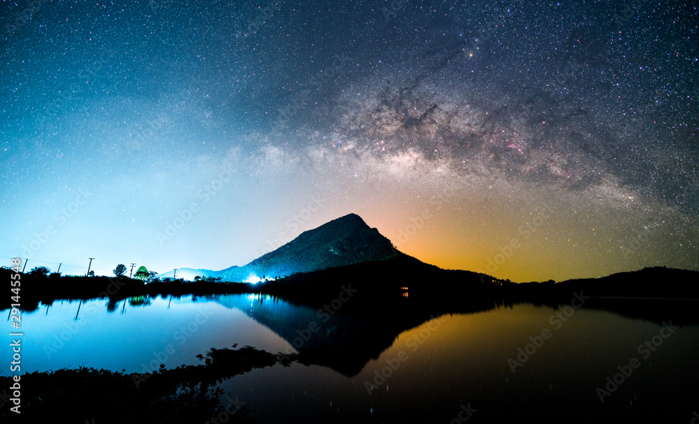 Beautiful night landscape of milky way galaxy over the mountain and lake foreground. Long exposure photography of night sky. - obrazy, fototapety, plakaty 