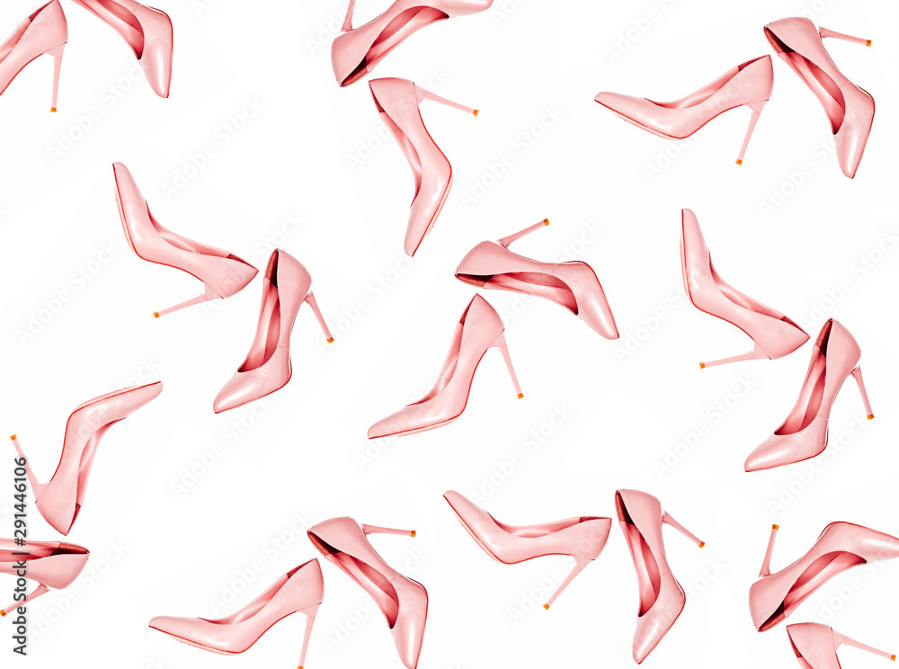 Pale pink female shoes pattern on pink coral background. Flat lay, top view trendy fashion feminine background. Beauty blog concept. Pale pink female shoes pattern on pink coral background. Flat lay, top view trendy fashion feminine background. Beauty blog concept.